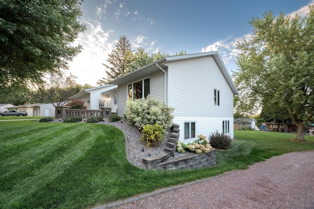 791 Highland Rd, Windom, MN 56101 - view of home's exterior featuring a yard and a wooden deck
