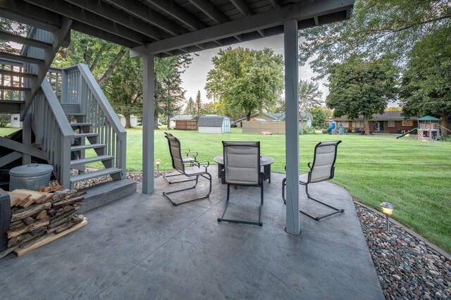 791 Highland Rd, Windom, MN 56101 - view of patio / terrace featuring stairs, a playground, a storage shed, and an outdoor structure