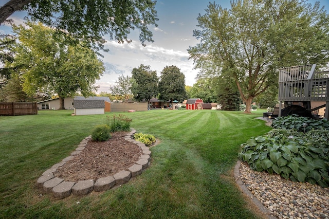 791 Highland Rd, Windom, MN 56101 - view of yard with a shed, an outbuilding, a wooden deck, and stairway