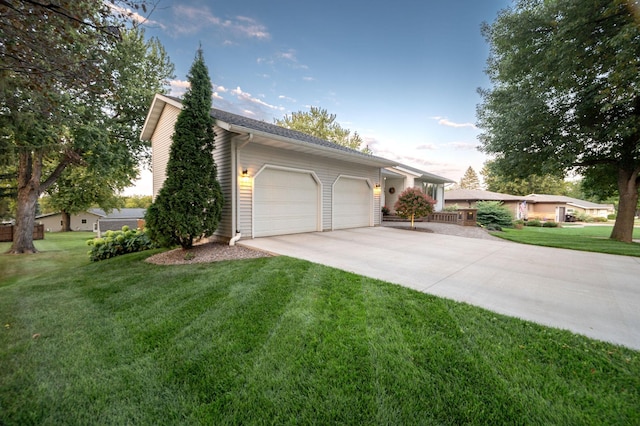 791 Highland Rd, Windom, MN 56101 - view of front of house with driveway, a garage, and a front lawn