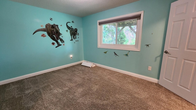 2339 2nd Ave SW, Rochester, MN 55902 - spare room with carpet floors, a textured ceiling, and baseboards