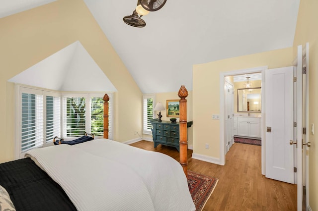 28 Greenway Gables, Minneapolis, MN 55403 - bedroom with light wood-type flooring and vaulted ceiling