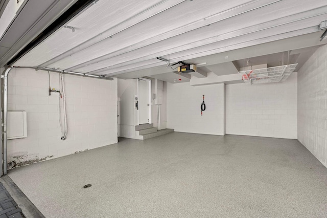 28 Greenway Gables, Minneapolis, MN 55403 - garage with concrete block wall and a garage door opener