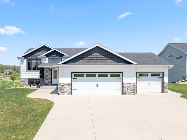 409 10th St NW, Dodge Center, MN 55927 - craftsman inspired home featuring an attached garage, driveway, a front yard, and stone siding