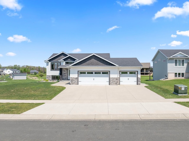 409 10th St NW, Dodge Center, MN 55927 - craftsman inspired home with a front lawn, stone siding, a garage, and driveway