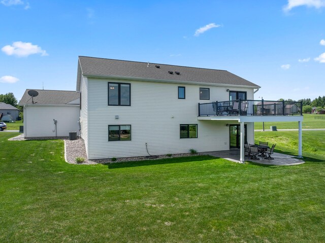 409 10th St NW, Dodge Center, MN 55927 - back of house with a patio area, a lawn, and a wooden deck