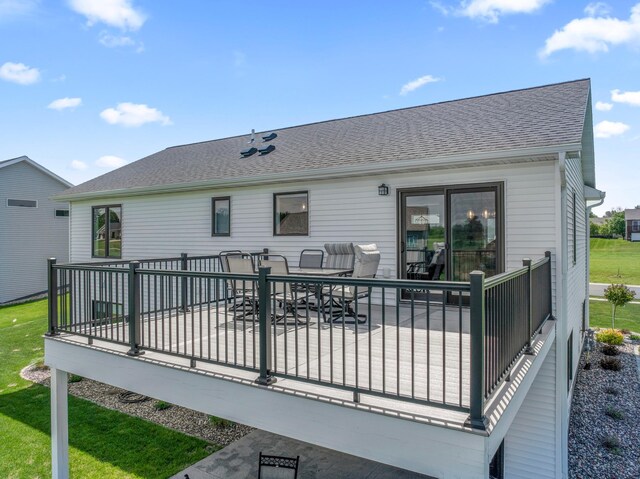 409 10th St NW, Dodge Center, MN 55927 - back of property with a shingled roof and a patio