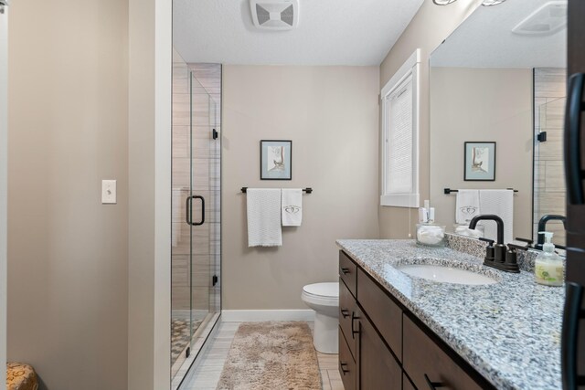 409 10th St NW, Dodge Center, MN 55927 - full bath with toilet, a stall shower, baseboards, and vanity