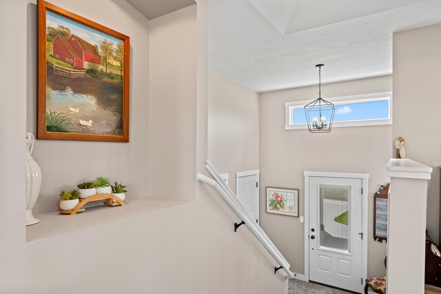 409 10th St NW, Dodge Center, MN 55927 - entrance foyer with a chandelier