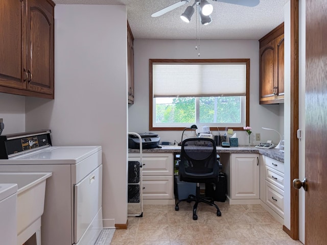 laundry area featuring washer / dryer, cabinet space, a ceiling fan, and a textured ceiling