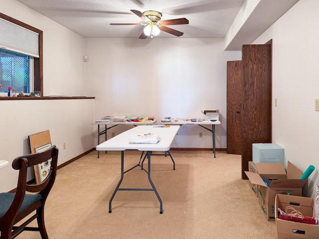 office with ceiling fan and light carpet