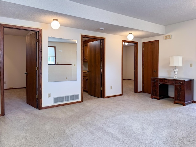 unfurnished bedroom featuring carpet flooring and baseboards