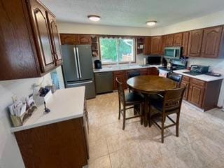 4715 Culver Rd, Golden Valley, MN 55422 - kitchen featuring appliances with stainless steel finishes and light countertops
