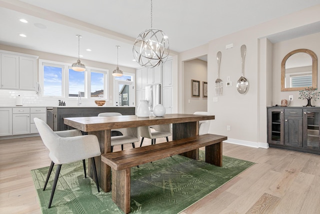 5068 Airlake Draw, Woodbury, MN 55129 - dining space featuring light wood-style flooring, wine cooler, recessed lighting, baseboards, and a chandelier
