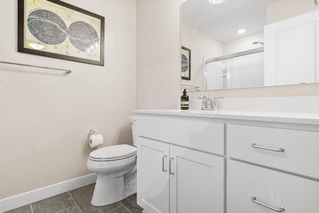 5068 Airlake Draw, Woodbury, MN 55129 - bathroom with vanity, baseboards, tile patterned flooring, an enclosed shower, and toilet