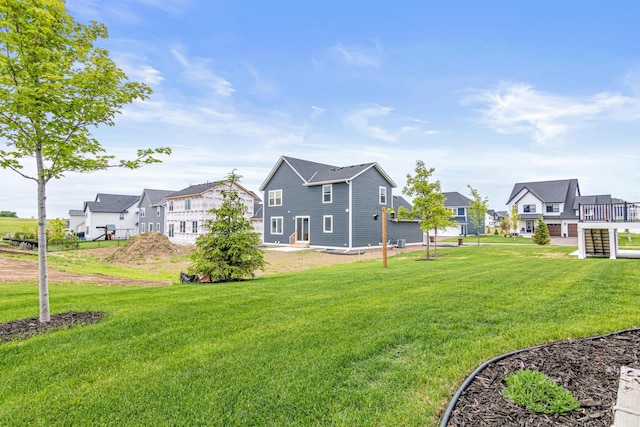 5068 Airlake Draw, Woodbury, MN 55129 - view of grassy yard featuring a residential view
