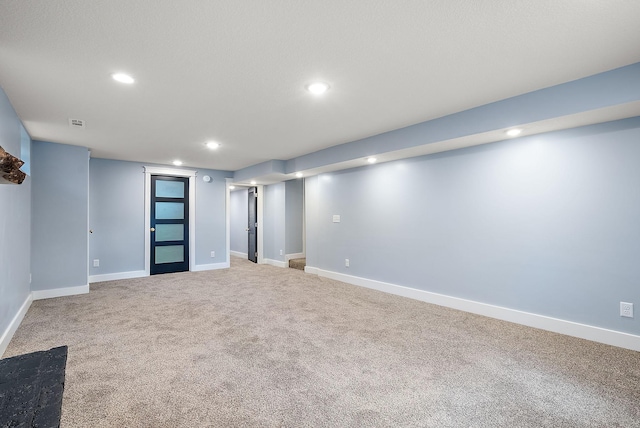 finished below grade area featuring recessed lighting, carpet flooring, and baseboards