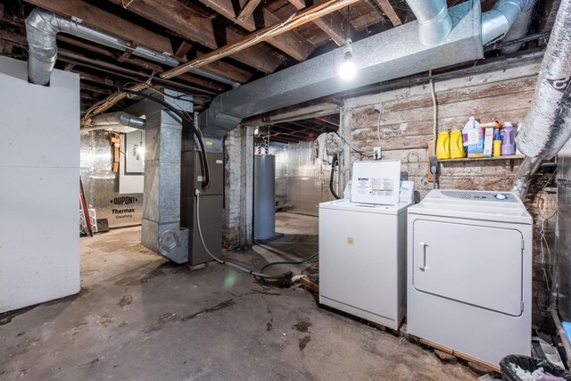 403 Spruce St, Fergus Falls, MN 56537 - unfinished basement featuring washer and dryer, water heater, and heating unit