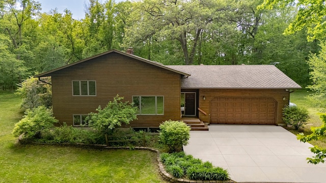 N8545 1205th St, Clifton Twp, WI 54022 - chalet / cabin with an attached garage, concrete driveway, a chimney, and a front lawn