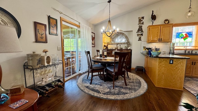 33401 Lakes Trl, Chisago Lake Twp, MN 55045 - dining room featuring dark wood-style floors, vaulted ceiling, a chandelier, and healthy amount of natural light