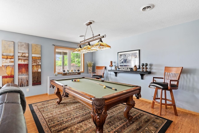 33401 Lakes Trl, Chisago Lake Twp, MN 55045 - playroom with a textured ceiling, billiards table, wood finished floors, and baseboards