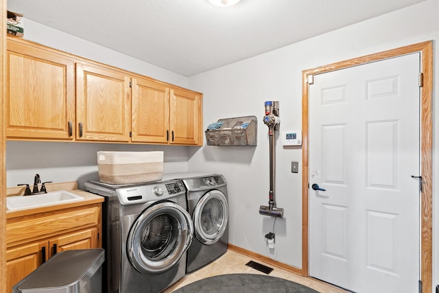 33401 Lakes Trl, Chisago Lake Twp, MN 55045 - laundry room with cabinet space and separate washer and dryer