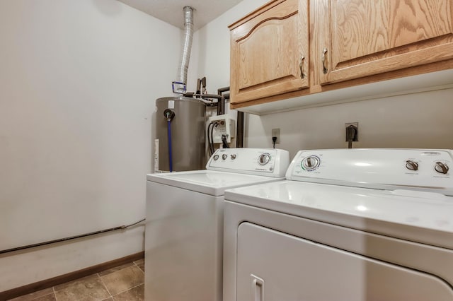 607 Wilson St, Downing, WI 54734 - laundry area featuring water heater, cabinet space, washer and dryer, and baseboards