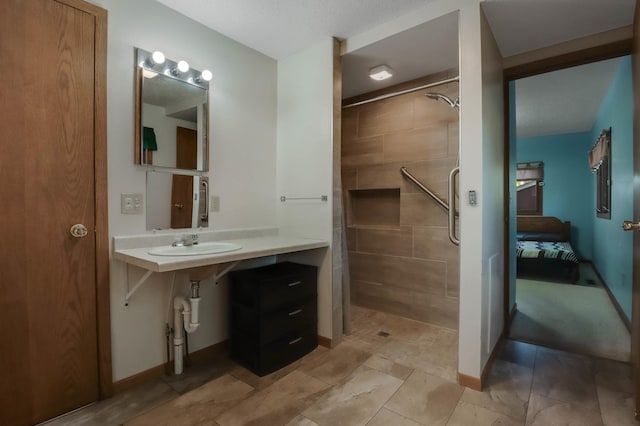 607 Wilson St, Downing, WI 54734 - full bath featuring tiled shower, a sink, and ensuite bathroom