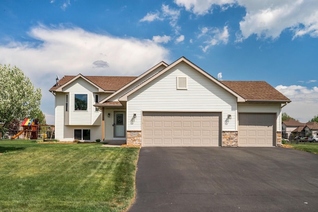 30237 Fox Run Rd, Stacy, MN 55079 - split level home with asphalt driveway, a garage, a front lawn, and stone siding