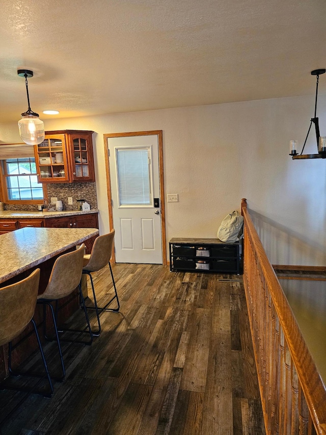 1005 8th Ave SW, Pipestone, MN 56164 - dining space with dark wood finished floors and a textured ceiling