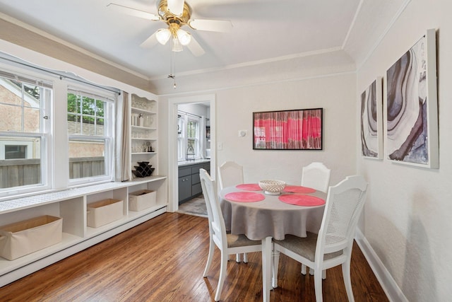 4613 34th Ave S, Minneapolis, MN 55406 - dining room with wood finished floors, ornamental molding, a ceiling fan, baseboards, and a baseboard heating unit
