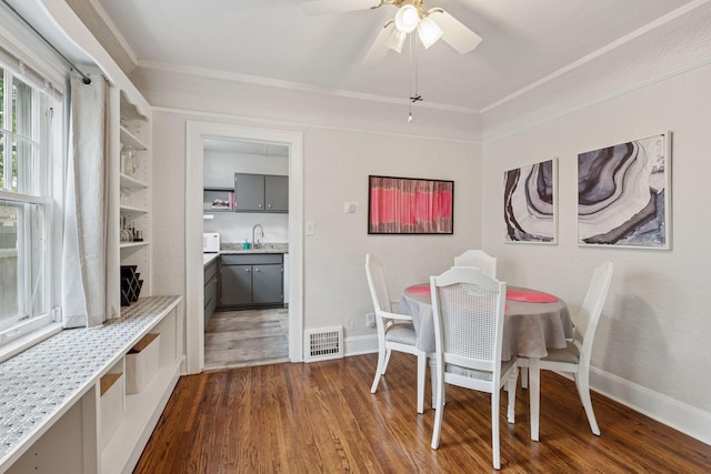 4613 34th Ave S, Minneapolis, MN 55406 - dining room with dark wood-style floors, ornamental molding, baseboards, and a ceiling fan