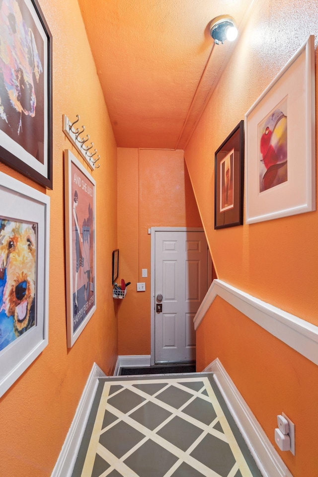 4613 34th Ave S, Minneapolis, MN 55406 - doorway to outside with a textured ceiling and baseboards