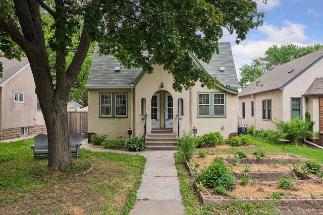 4613 34th Ave S, Minneapolis, MN 55406 - tudor home with stucco siding and fence