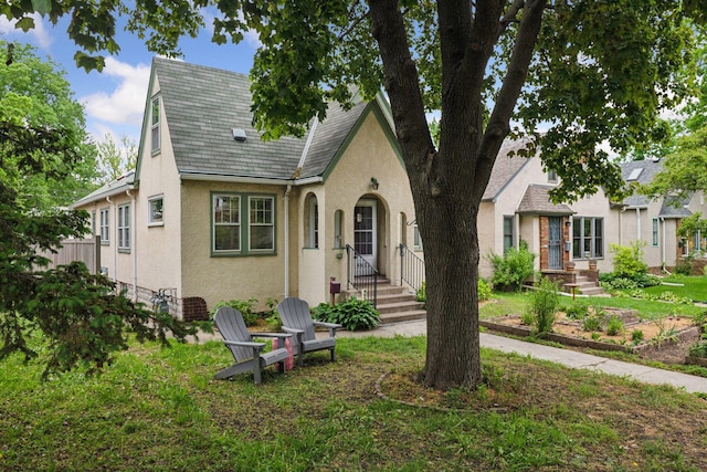 4613 34th Ave S, Minneapolis, MN 55406 - tudor-style house featuring stucco siding