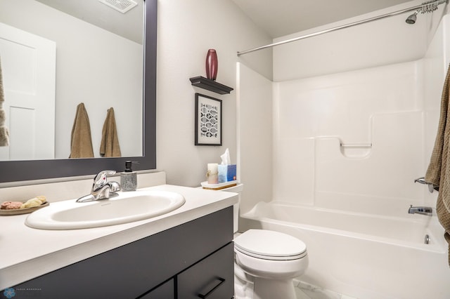 full bathroom featuring toilet, vanity, and washtub / shower combination