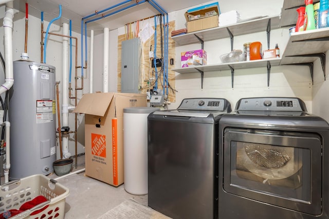 laundry area featuring electric panel, electric water heater, and independent washer and dryer