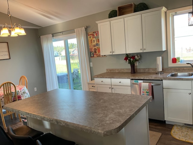 1218 8th Ave NW, Perham, MN 56573 - kitchen with stainless steel dishwasher, a sink, a chandelier, lofted ceiling, and dark wood-type flooring