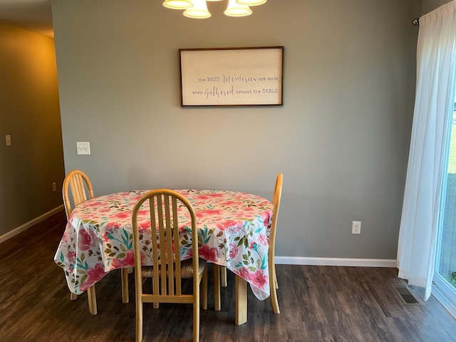 1218 8th Ave NW, Perham, MN 56573 - dining room with wood finished floors, baseboards, and a chandelier