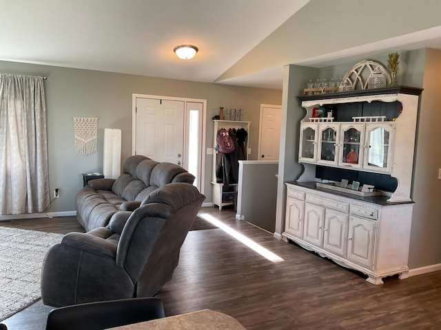 1218 8th Ave NW, Perham, MN 56573 - living room with baseboards, dark wood-style flooring, and lofted ceiling