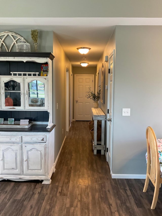 1218 8th Ave NW, Perham, MN 56573 - hallway with dark wood-style flooring and baseboards