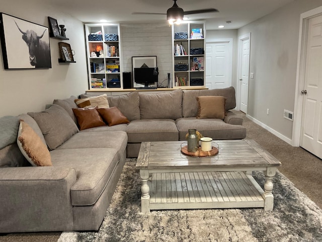 1218 8th Ave NW, Perham, MN 56573 - living area with ceiling fan, built in shelves, carpet floors, and baseboards