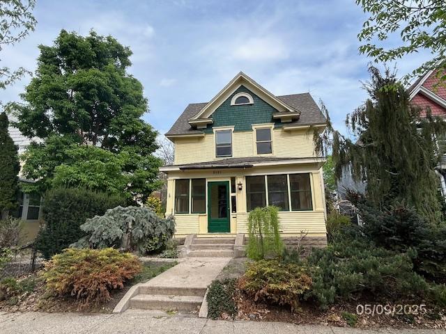 victorian-style house with a sunroom