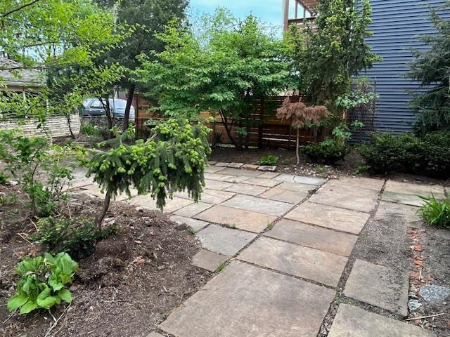 view of patio / terrace featuring fence