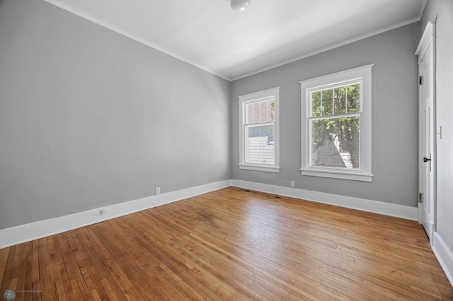 12 2nd St E, Ada, MN 56510 - spare room with ornamental molding, light wood-style flooring, and baseboards