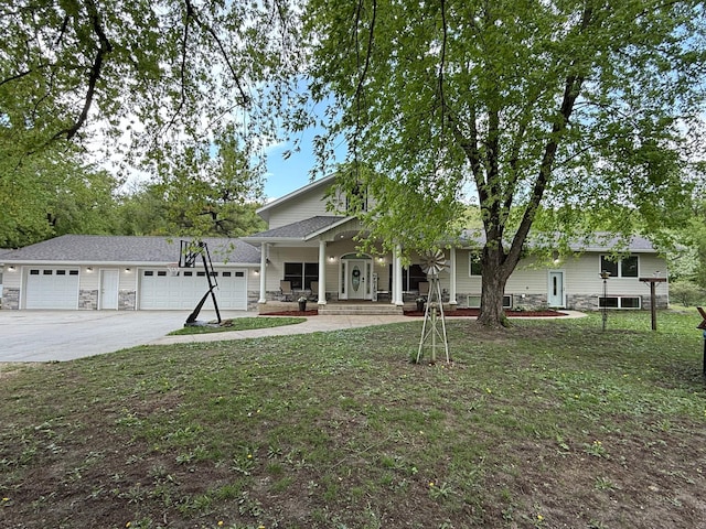 4615 County Road 5 NW, Byron, MN 55920 - view of front facade featuring covered porch, driveway, a garage, and stone siding