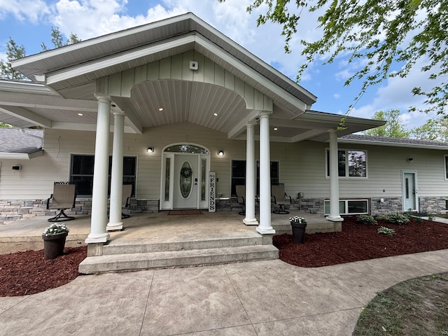 4615 County Road 5 NW, Byron, MN 55920 - doorway to property with a porch and stone siding