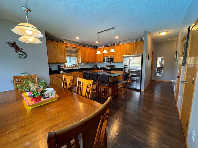 6158 Forest Boulevard Trl, Wyoming, MN 55092 - dining space with dark wood-type flooring, recessed lighting, and a textured ceiling