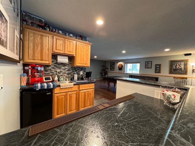 6158 Forest Boulevard Trl, Wyoming, MN 55092 - kitchen with recessed lighting, tasteful backsplash, dark countertops, dishwasher, and brown cabinets