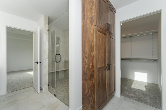bathroom featuring a stall shower